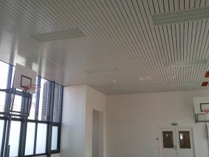 A heated or cooled strip ceiling